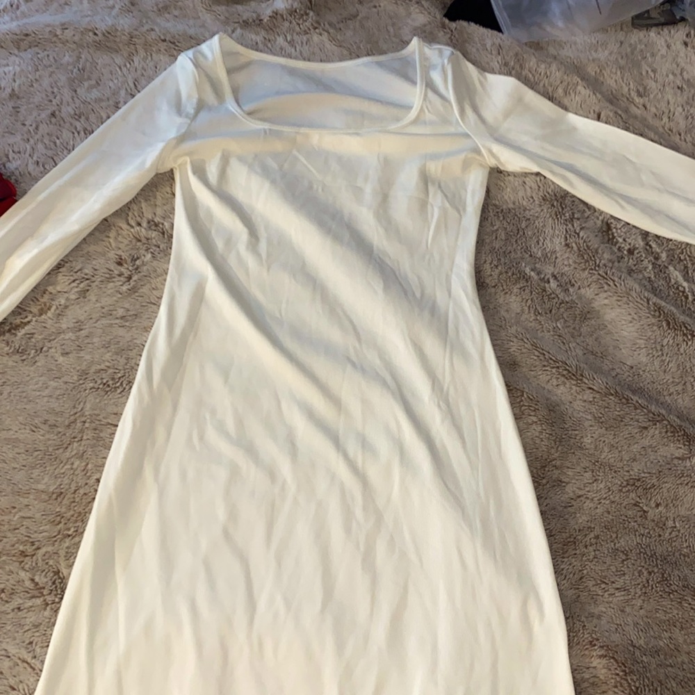 It’s a solid scoop neck maxi dress in the color white